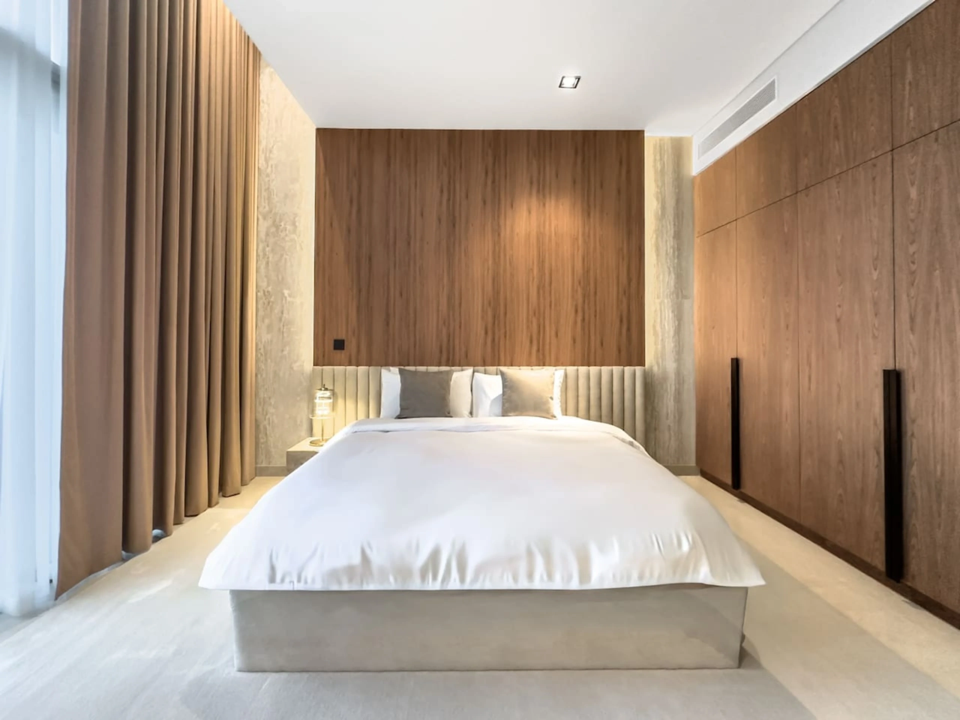 Golf Place Villa — bedroom with full-height walnut wall